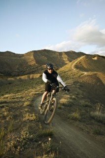 Man mountain biking on mountain track. Photo : Shawn O'Connor