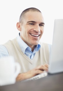 Portrait of cheerful office worker. Photo : Momentimages