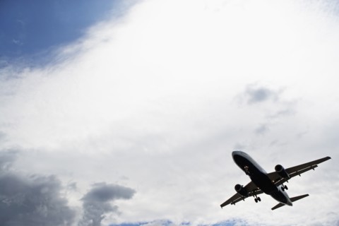 Silhouette of flying airplane. Photo : fotog