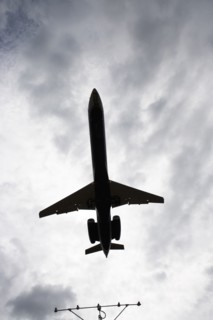 Silhouette of flying airplane. Photo : fotog