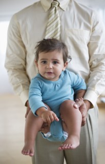 Father with small girl (12-18 months).