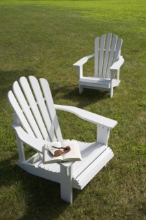 Two adirondack chairs on lawn. Photo : Chris Hackett