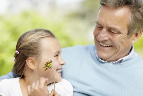Happy grandfather and granddaughter (10-11). Photo : Momentimages