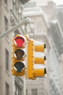 USA, New York, New York City, Snow covered traffic lights.