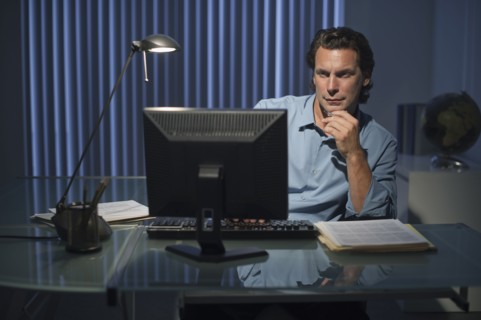 Man working late in office.