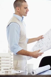 Architect working in office. Photo : Momentimages