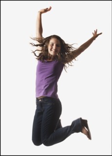Woman jumping on white background. Photo : Mike Kemp