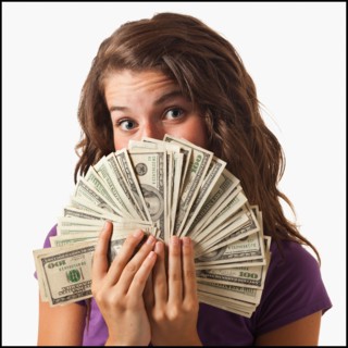 Young woman holding fanned out banknotes. Photo : Mike Kemp