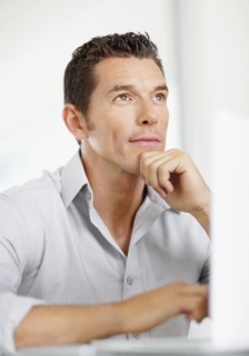 Portrait of good-looking mid adult man contemplating. Photo : Momentimages