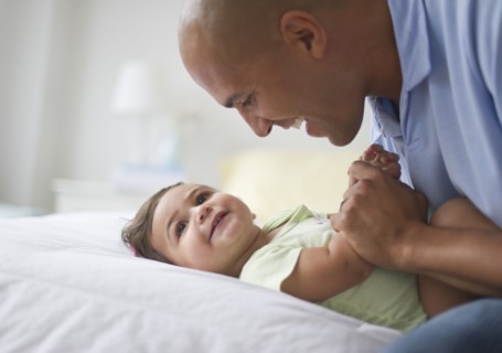 Father with small girl (12-18 months).