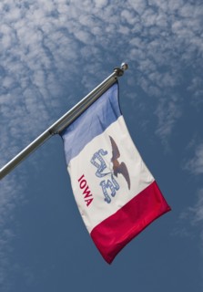 USA, Iowa State flag against sky.