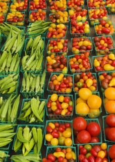 Boxes with vegetables on street market.