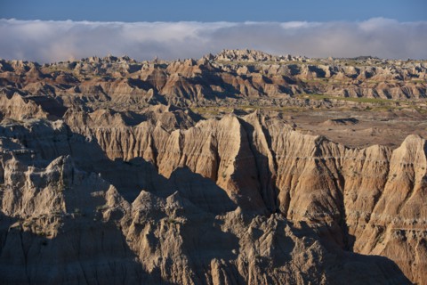 USA, South Dakota, Mountains in morning fog in Badlands National Park.