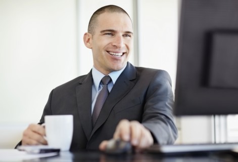 Businessman working in office. Photo : Momentimages