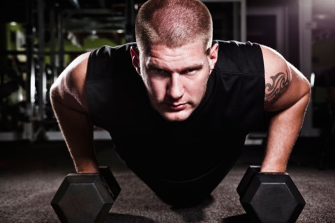 Mid adult man working out in gym. Photo : Take A Pix Media