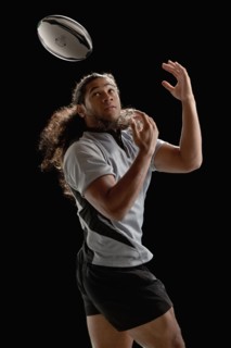 Male rugby player catching ball. Photo : Mike Kemp