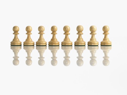 Row of pawn chess pieces. Photo : David Arky