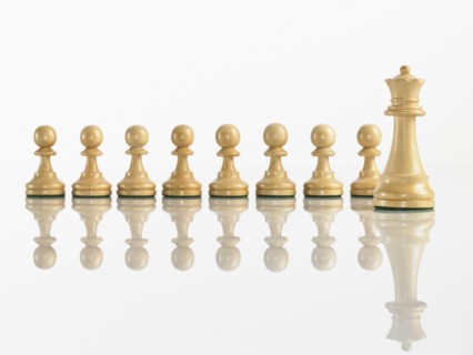 Queen with pawn chess pieces. Photo : David Arky