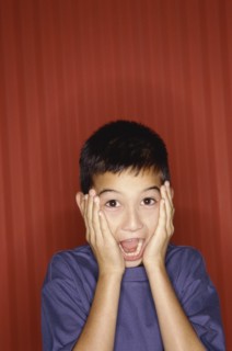 Surprised young boy. Photo : Fisher Litwin