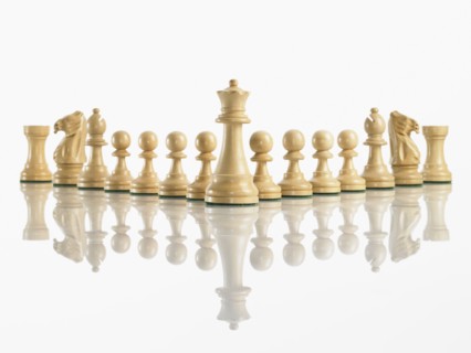 King with team of chess pieces. Photo : David Arky