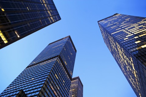 USA, New York State, New York City, Manhattan, low angle view of office buildings illuminated at