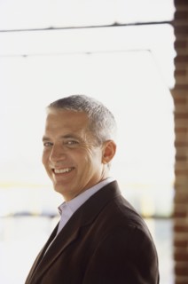 Handsome man wearing suit. Photo : Fisher Litwin