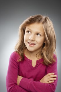 Studio portrait of girl (10-11) smiling. Photo : FBP