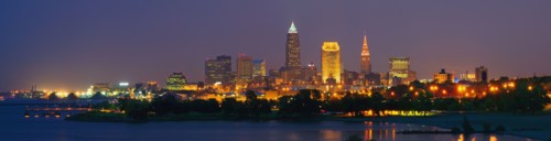 USA, Ohio, Cleveland, City skyline illuminated at dusk. Photo : Gary J Weathers