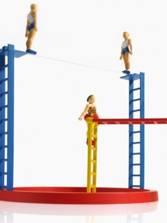 Studio shot of figurines on ladders. Photo : David Arky