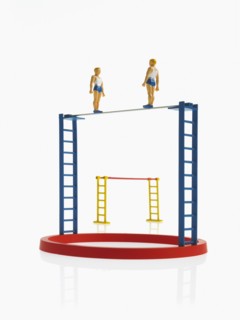 Studio shot of figurines on ladders. Photo : David Arky