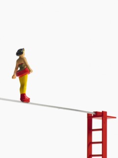 Studio shot of figurines on ladders. Photo : David Arky
