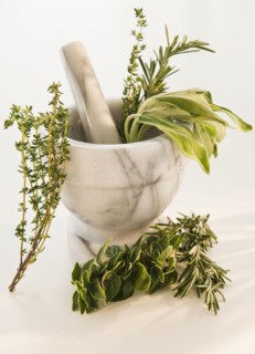 Mortar and pestle with herbs. Photo : Daniel Grill