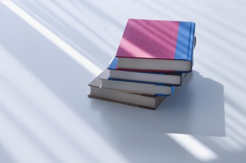 Sunlight on stacked books.