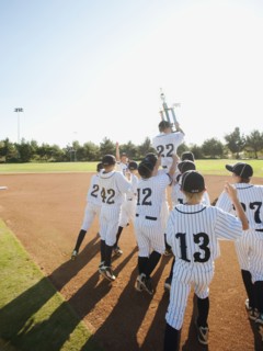 USA, California, Ladera Ranch, little league players (aged 10-11) celebrating.