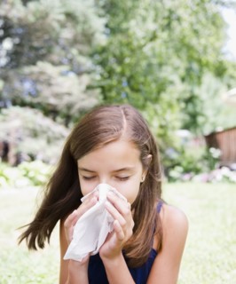 USA, New York, Girl (10-11) blowing nose. Photo : Jamie Grill Photography
