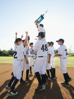 USA, California, Ladera Ranch, Boys (10-11) from Little league celebrating after winning.