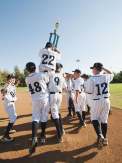 USA, California, Ladera Ranch, Boys (10-11) from Little league celebrating after winning.