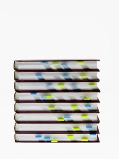 Studio shot of heap of books with index cards. Photo : David Arky