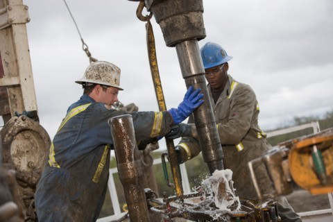 Oil workers drilling for oil on rig. Photo : Dan Bannister