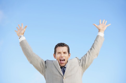South Africa, Happy businessman, low angle view. Photo : momentimages