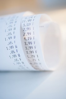 Rolled up receipts with prices.