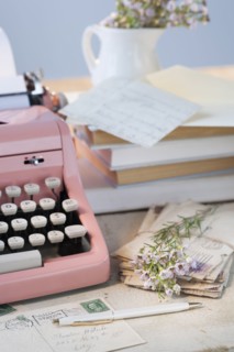 Letters by antique typewriter.