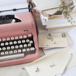 Letters by antique typewriter.