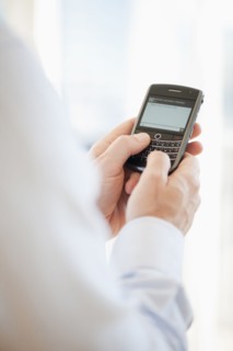 USA, New Jersey, Jersey City, Man holding mobile phone .