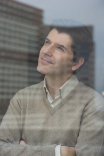 USA, New Jersey, Jersey City, Businessman looking through window.