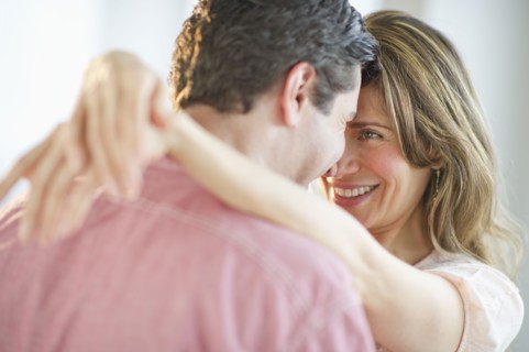 USA, New Jersey, Jersey City, Couple embracing, smiling.