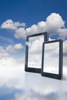 Two digital tablets floating in clouds.