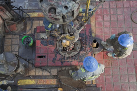 Oil workers drilling for oil on rig. Photo : Dan Bannister
