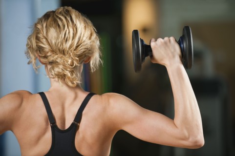 USA, California, Los Angeles, woman exercising with dumbbells.