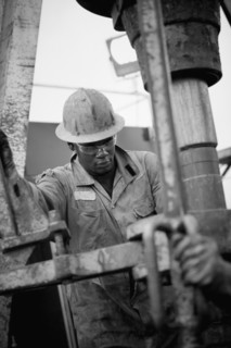 Oil worker drilling for oil on rig. Photo : Dan Bannister